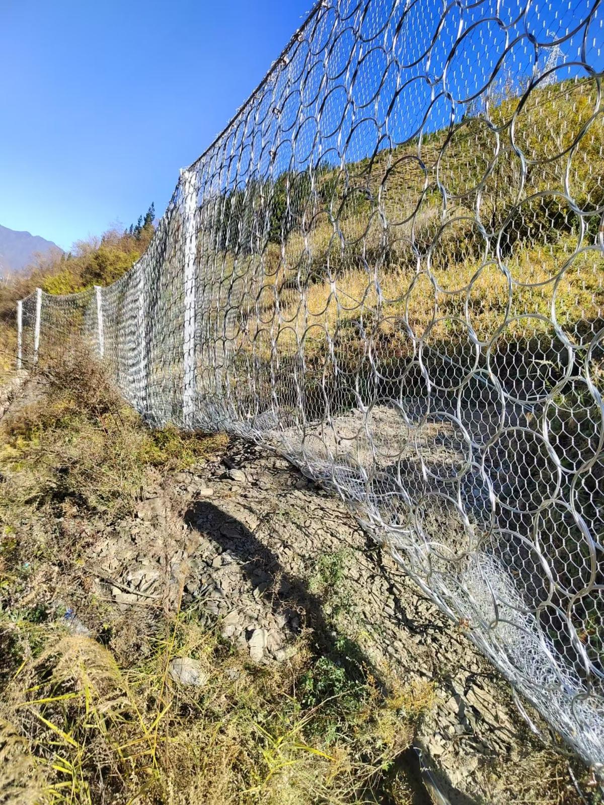 Close-up of ring net barrier with interlocking steel rings